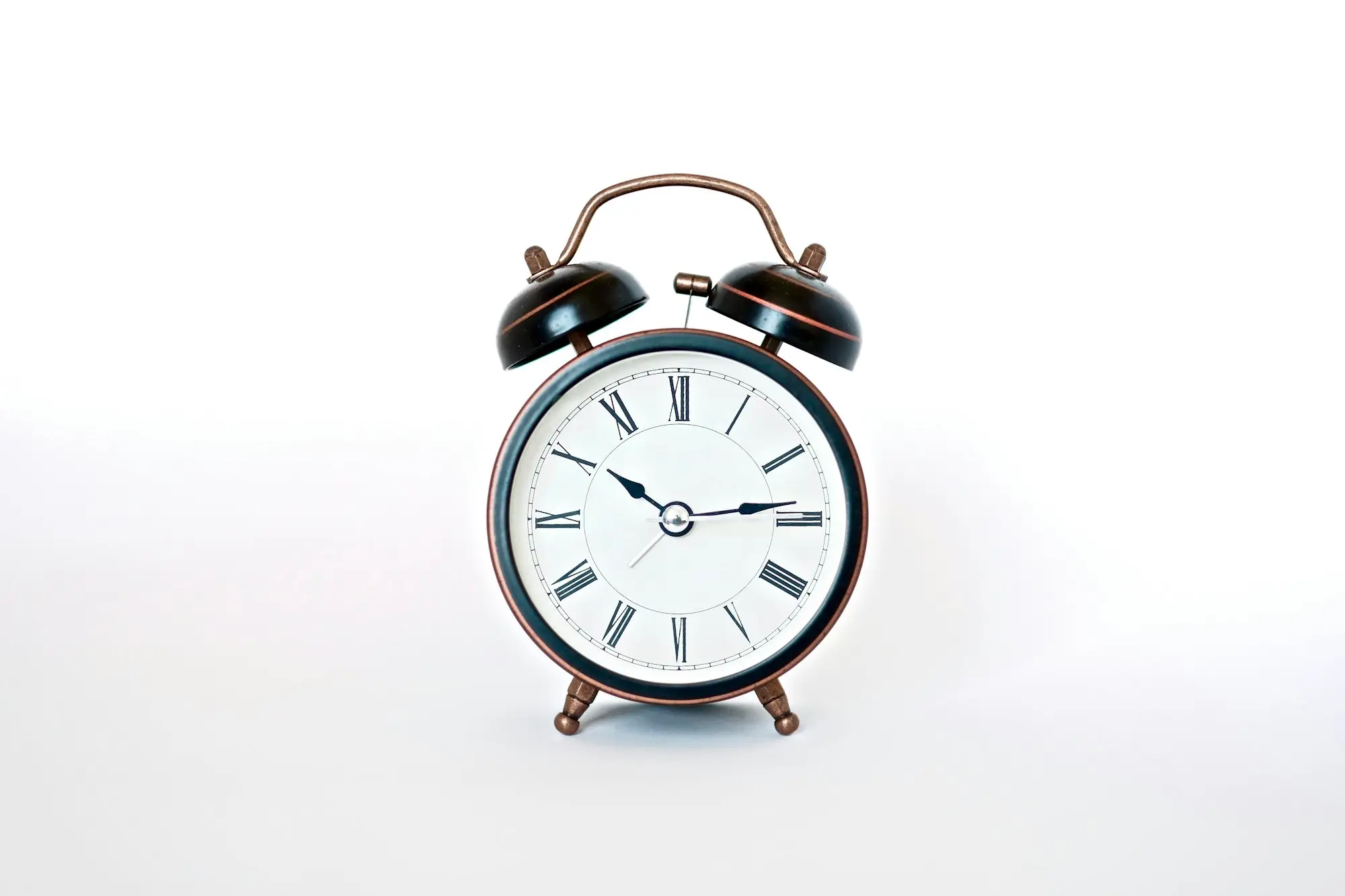 Black and white alarm clock, representing urgent business funding with a deadline
