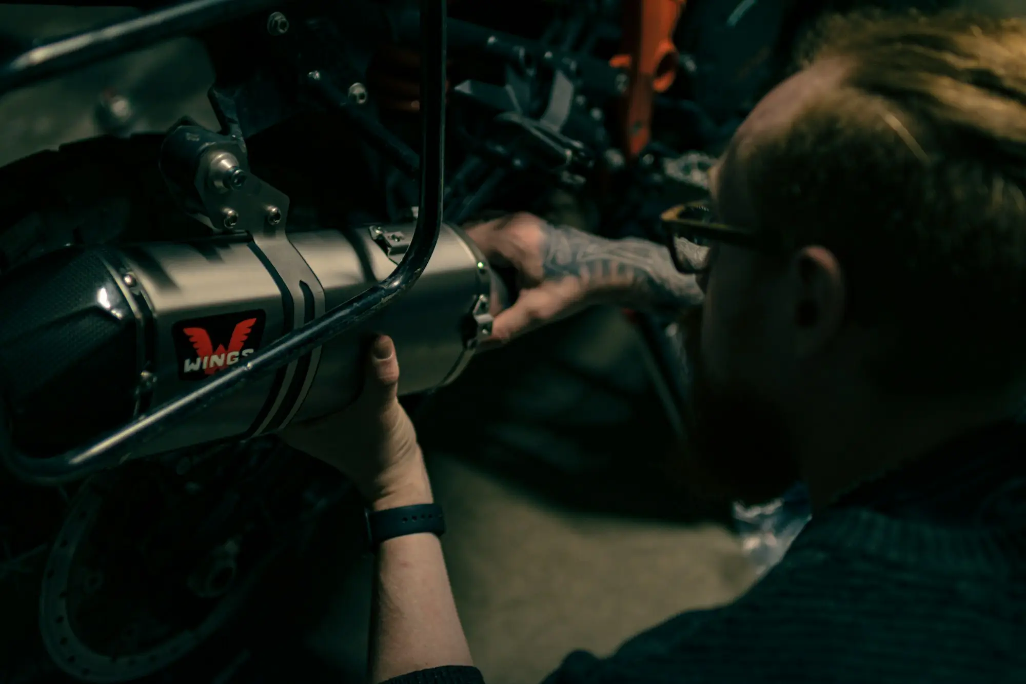 Mechanic working with a spanner in a workshop, a business that relies on equipment