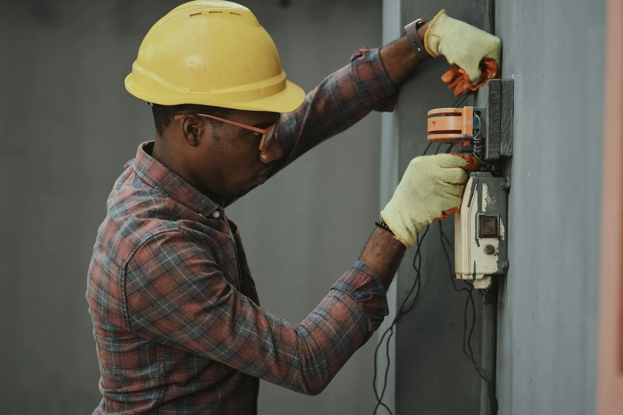 Worker in a hard hat and work shirt on site, representing labour hire and contracting businesses